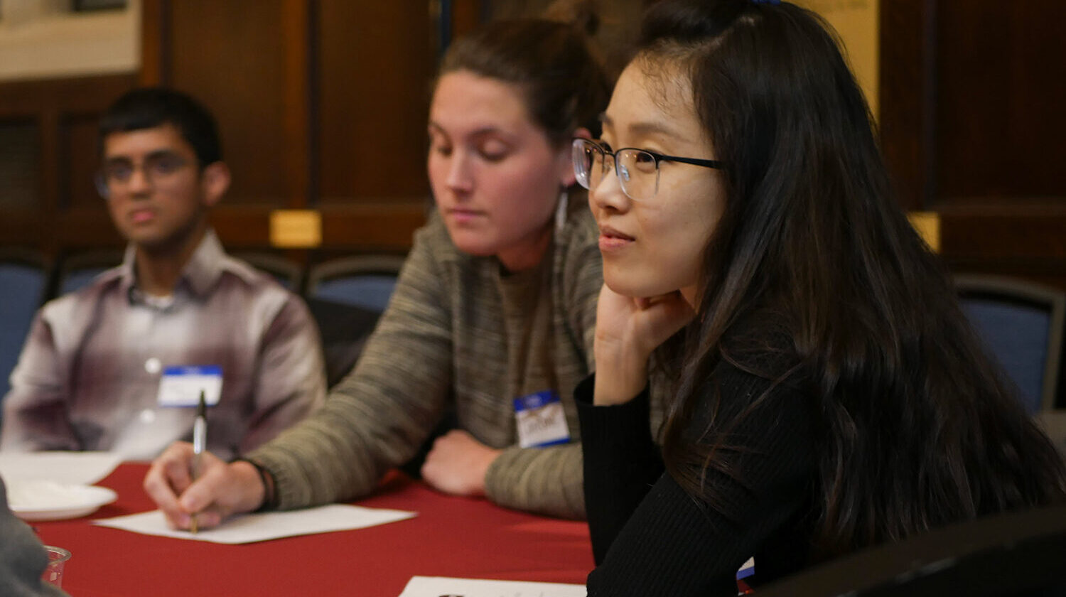 Inaugural Fellows sitting at table