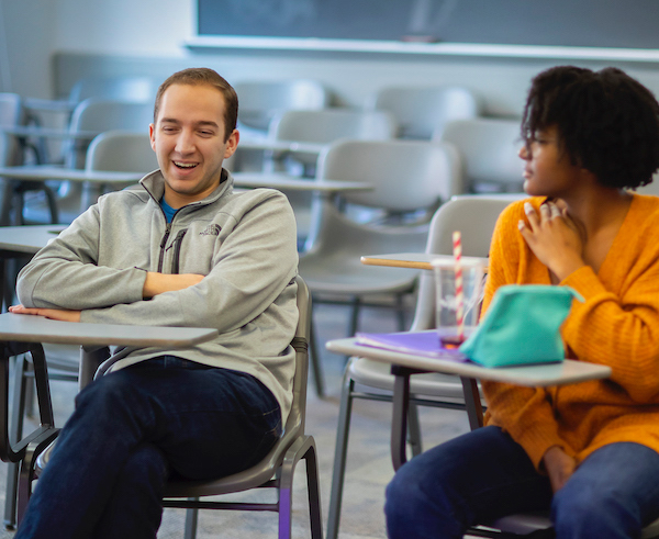 Wharton student Connor Gibson smiles in classroom