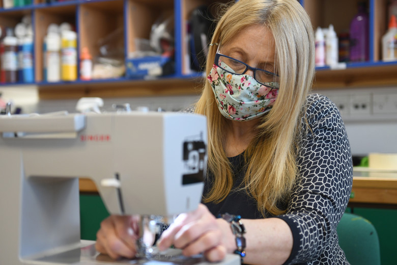 Woman sewing a facemask