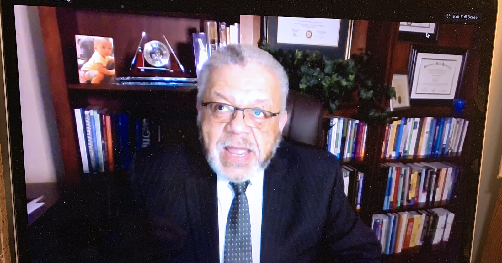 Police Commissioner Charles Ramsey on computer screen talking during event on police reform