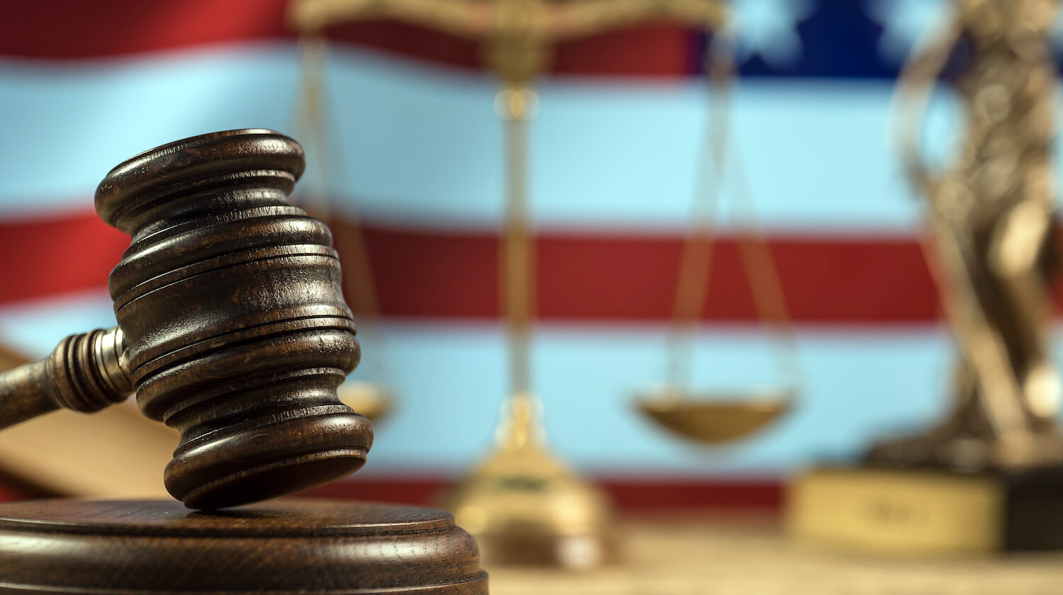 Judges gavel, justice scales, American flag