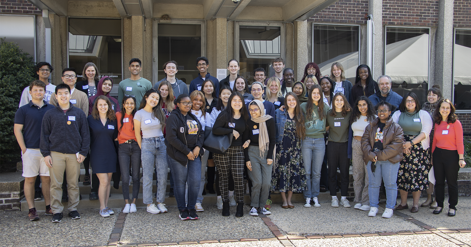 students, faculty, and staff standing in group