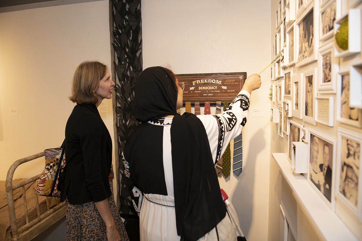 two people talking about art exhibition