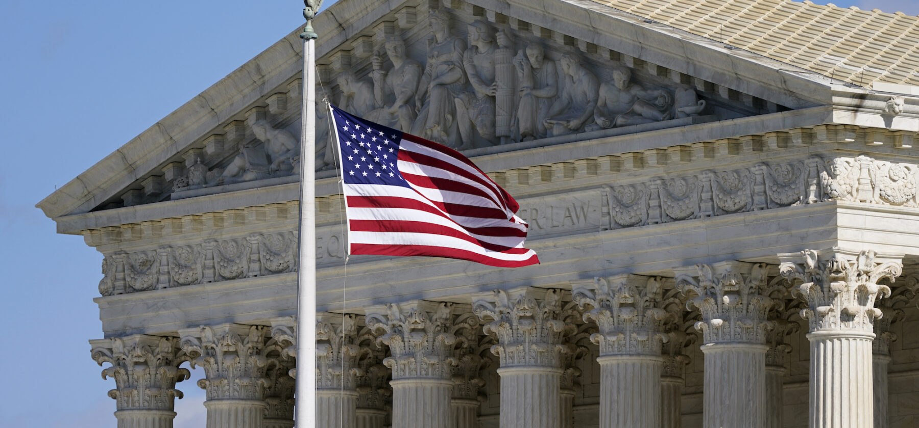 An American flag waves in front of the Supreme Court building on Capitol Hill in Washington, on Nov. 2, 2020. The Supreme Court heard oral arguments in two cases that could decide the future of affirmative action in college admissions on Monday, Oct. 31, 2022, in Washington, D.C. (Image: AP Photo/Patrick Semansky, File)