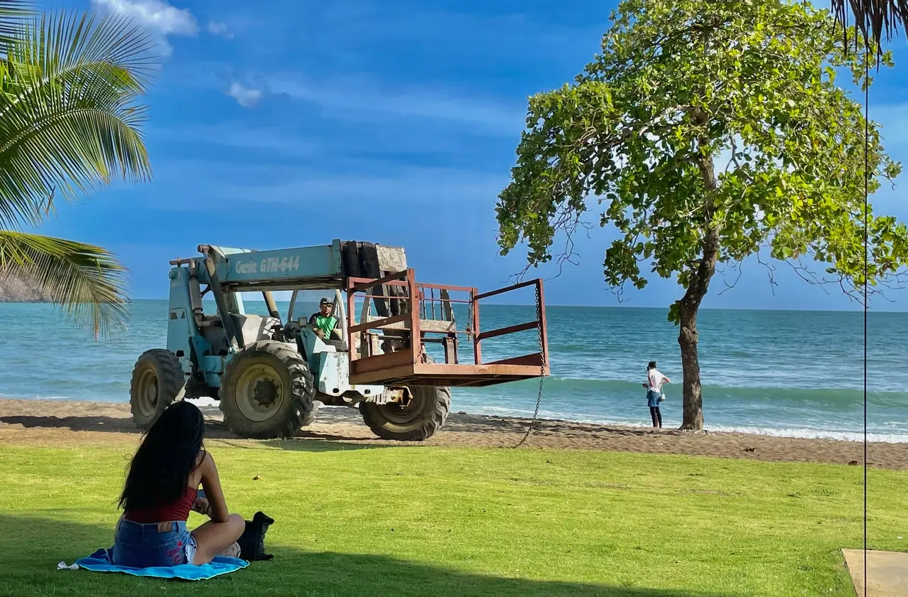 A construction vehicle drives along the beach in Playa Venao, Panama, on May 18, 2023. | Photos by Anusha Mathur for POLITICO