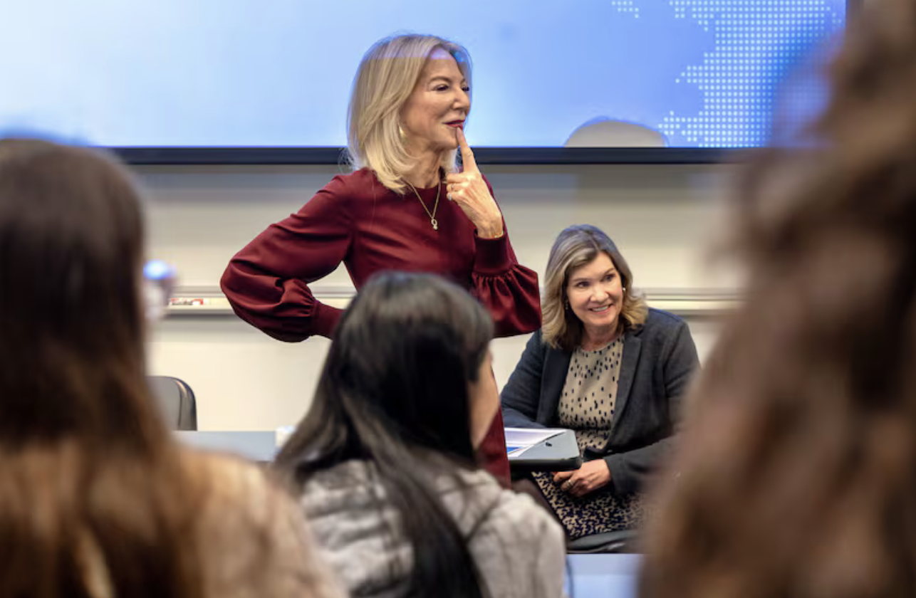 professor with students in classroom